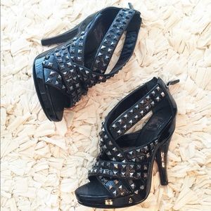 Authentic Burberry black patent studded cross heel